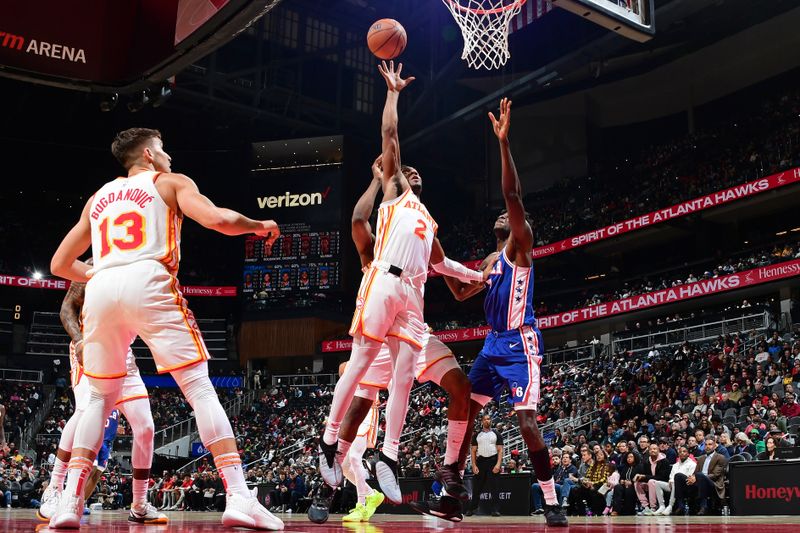 ATLANTA, GA - JANUARY 10: Trent Forrest #2 of the Atlanta Hawks rebounds during the game against the Philadelphia 76ers on January 10, 2024 at State Farm Arena in Atlanta, Georgia.  NOTE TO USER: User expressly acknowledges and agrees that, by downloading and/or using this Photograph, user is consenting to the terms and conditions of the Getty Images License Agreement. Mandatory Copyright Notice: Copyright 2024 NBAE (Photo by Scott Cunningham/NBAE via Getty Images)