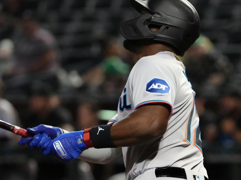 May 9, 2023; Phoenix, Arizona, USA; Miami Marlins designated hitter Jorge Soler (12) hits a home run against the Arizona Diamondbacks during the fifth inning at Chase Field. Mandatory Credit: Joe Camporeale-USA TODAY Sports