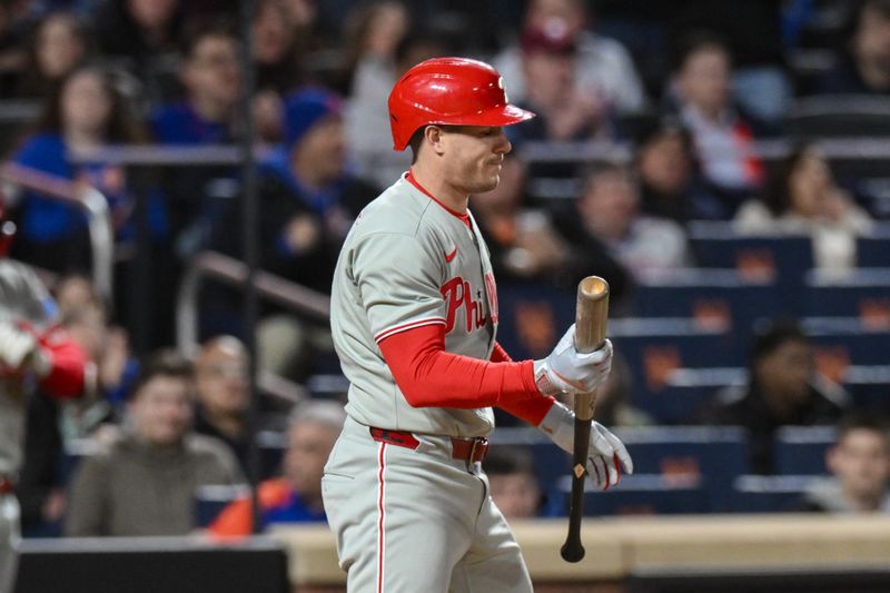 Apr 21, 2025; New York City, New York, USA; Philadelphia Phillies catcher J.T. Realmuto (10) reacts after striking out against the New York Mets during the sixth inning at Citi Field. Mandatory Credit: John Jones-Imagn Images