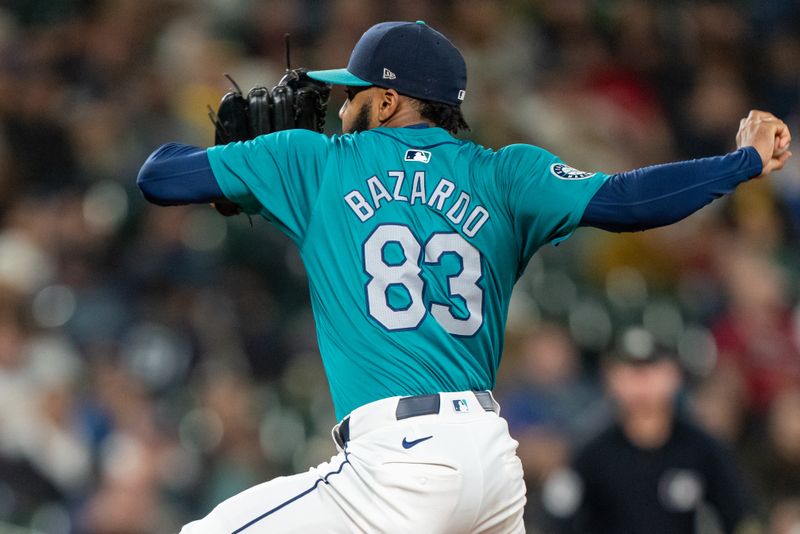 Sep 28, 2024; Seattle, Washington, USA; Seattle Mariners reliever Eduard Bazardo (83) delivers a pitch during the tenth inning against the Oakland Athletics at T-Mobile Park. Mandatory Credit: Stephen Brashear-Imagn Images