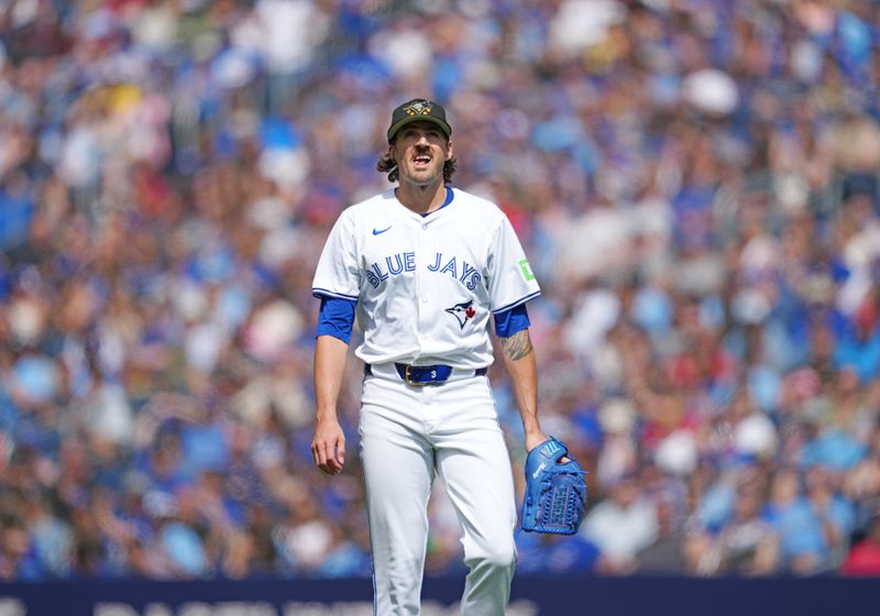 May 18, 2024; Toronto, Ontario, CAN; Toronto Blue Jays staring pitcher Kevin Gausman (34) walks towards the dugout during the first inning against the Tampa Bay Rays at Rogers Centre. Mandatory Credit: Nick Turchiaro-USA TODAY Sports