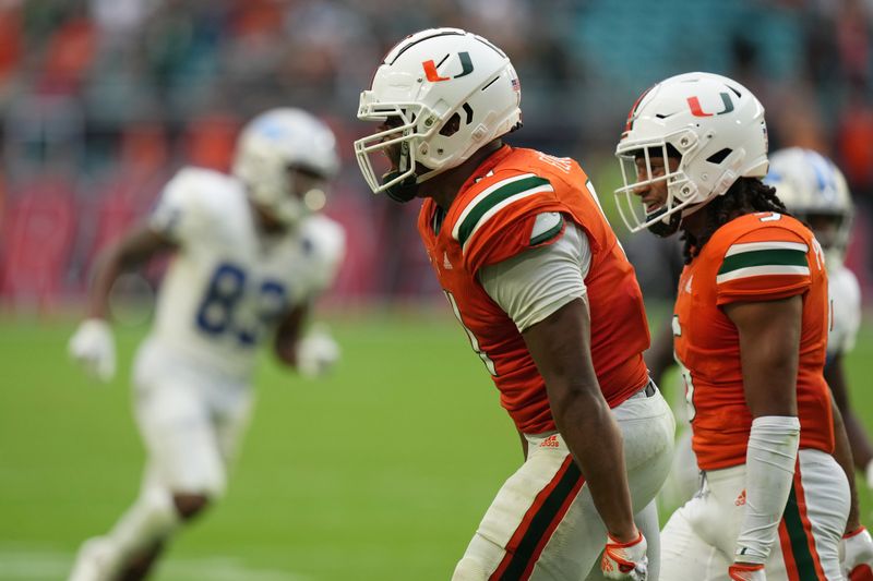 Sep 24, 2022; Miami Gardens, Florida, USA; Miami Hurricanes linebacker Corey Flagg Jr. (11) reacts after sacking Middle Tennessee Blue Raiders quarterback Chase Cunningham (not pictured) during the second half at Hard Rock Stadium. Mandatory Credit: Jasen Vinlove-USA TODAY Sports