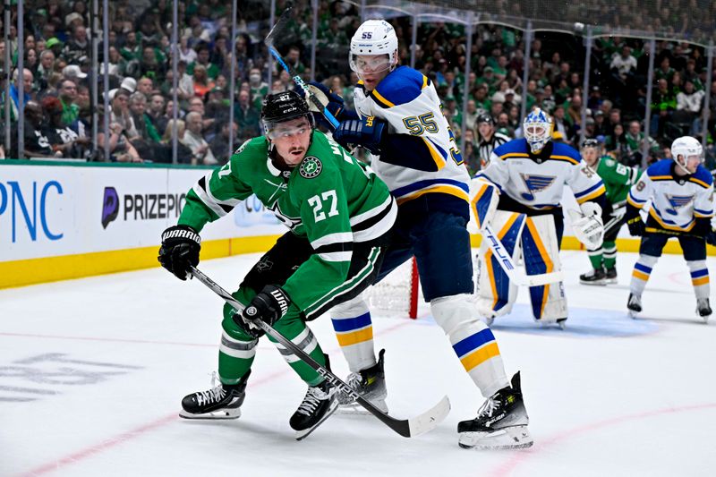 Apr 17, 2024; Dallas, Texas, USA; Dallas Stars left wing Mason Marchment (27) battles for position with St. Louis Blues defenseman Colton Parayko (55) during the second period at the American Airlines Center. Mandatory Credit: Jerome Miron-USA TODAY Sports