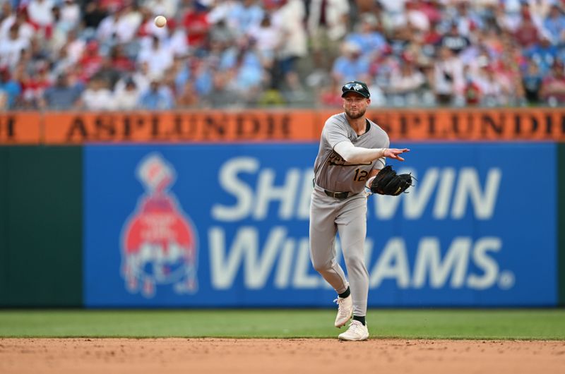 Jul 13, 2024; Philadelphia, Pennsylvania, USA; Oakland Athletics infielder Max Schuemann (12) throws to first against the Philadelphia Phillies in the fifth inning at Citizens Bank Park. Mandatory Credit: Kyle Ross-USA TODAY Sports