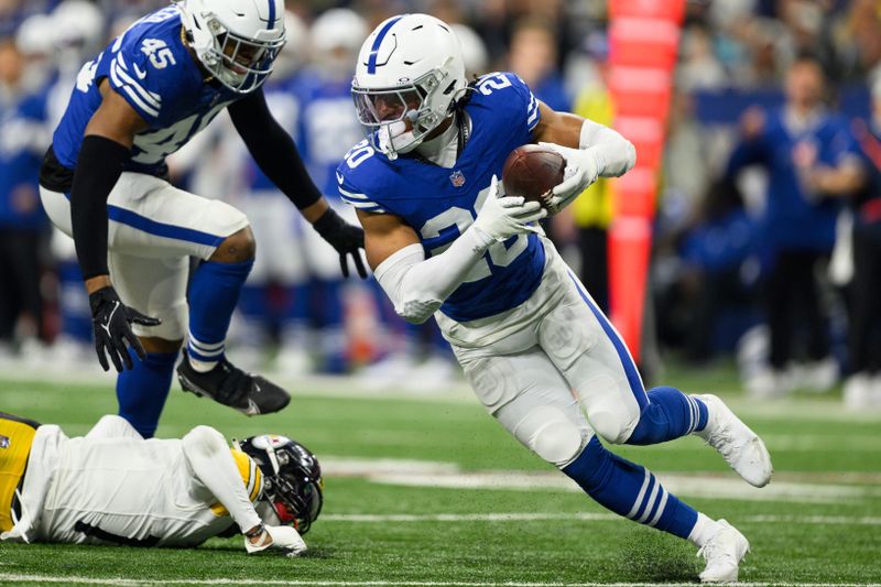 Indianapolis Colts safety Nick Cross (20) intercepts a pass intended for Pittsburgh Steelers wide receiver George Pickens (14) during an NFL football game, Saturday, Dec. 16, 2023, in Indianapolis. (AP Photo/Zach Bolinger)