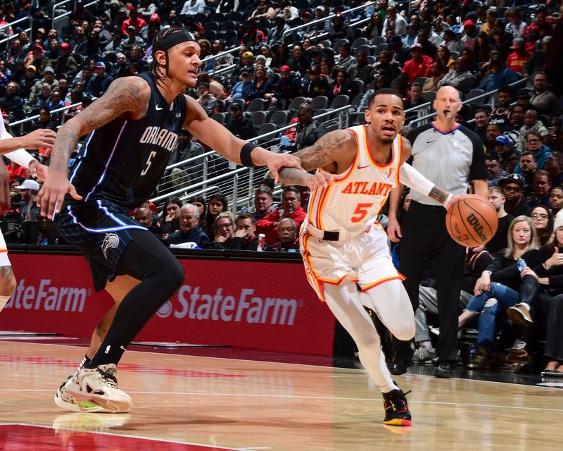 ATLANTA, GA - JANUARY 17: Dejounte Murray #5 of the Atlanta Hawks goes to the basket during the game on January 17, 2024 at State Farm Arena in Atlanta, Georgia.  NOTE TO USER: User expressly acknowledges and agrees that, by downloading and/or using this Photograph, user is consenting to the terms and conditions of the Getty Images License Agreement. Mandatory Copyright Notice: Copyright 2024 NBAE (Photo by Scott Cunningham/NBAE via Getty Images)