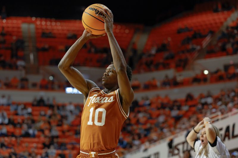 Jan 7, 2023; Stillwater, Oklahoma, USA; Texas Longhorns guard Sir'Jabari Rice (10) shoots a three point basket against the Oklahoma State Cowboys during the second half at Gallagher-Iba Arena. Mandatory Credit: Alonzo Adams-USA TODAY Sports