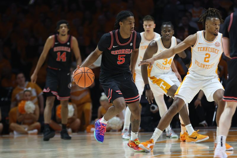 Jan 15, 2025; Knoxville, Tennessee, USA; Georgia Bulldogs guard Silas Demary Jr. (5) dribbles against the Tennessee Volunteers during the first half at Thompson-Boling Arena at Food City Center. Mandatory Credit: Randy Sartin-Imagn Images