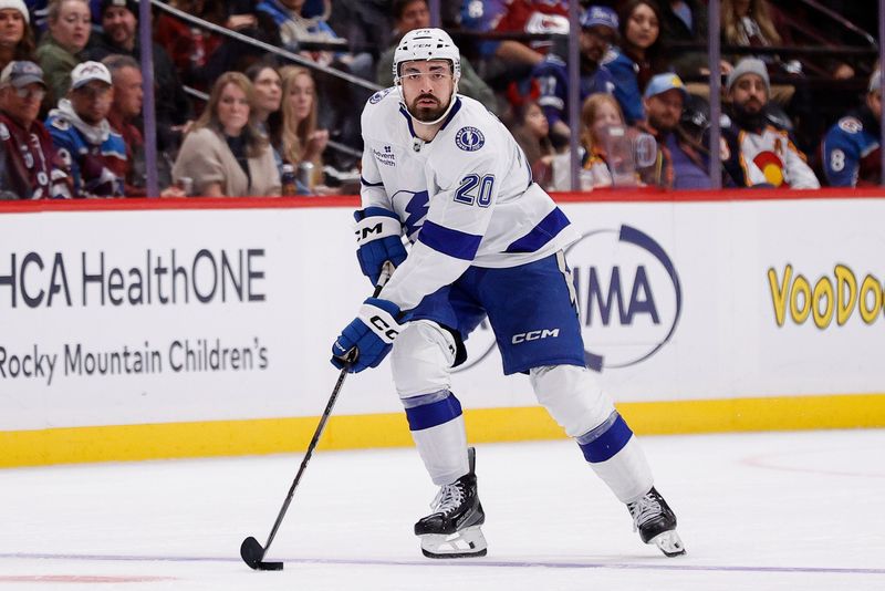 Oct 30, 2024; Denver, Colorado, USA; Tampa Bay Lightning left wing Nick Paul (20) controls the puck in the third period against the Colorado Avalanche at Ball Arena. Mandatory Credit: Isaiah J. Downing-Imagn Images