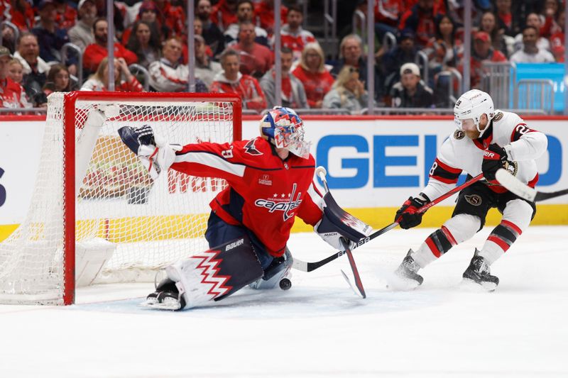 Apr 7, 2024; Washington, District of Columbia, USA; Washington Capitals goaltender Charlie Lindgren (79) makes a save on Ottawa Senators right wing Claude Giroux (28) in the second period at Capital One Arena. Mandatory Credit: Geoff Burke-USA TODAY Sports