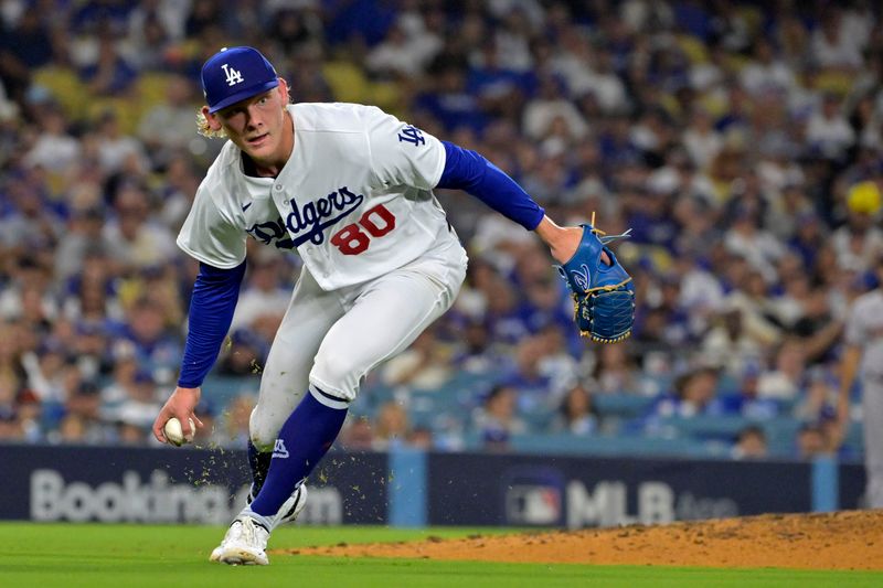 Oct 7, 2023; Los Angeles, California, USA; Los Angeles Dodgers starting pitcher Emmet Sheehan (80) makes a throw to first base against the Arizona Diamondbacks during the third inning for game one of the NLDS for the 2023 MLB playoffs at Dodger Stadium. Mandatory Credit: Jayne Kamin-Oncea-USA TODAY Sports