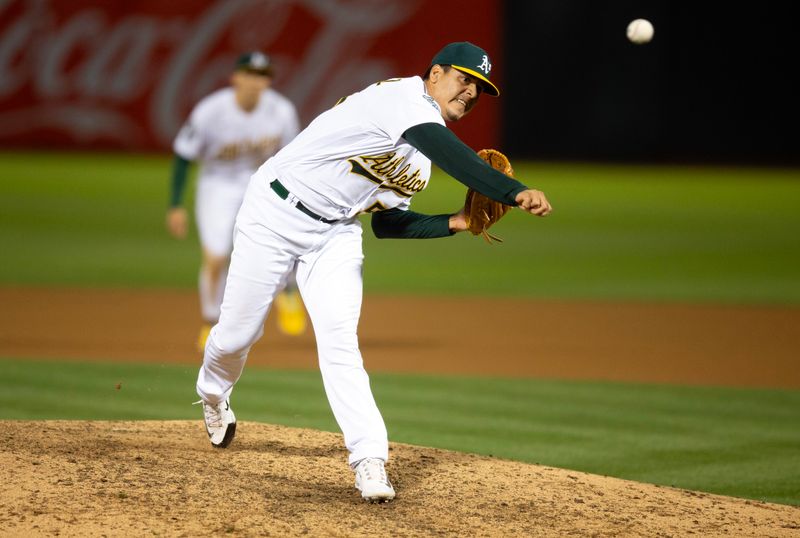 Aug 19, 2023; Oakland, California, USA; Oakland Athletics pitcher Adri  n Mart  nez (55) pitches against the Baltimore Orioles during the 10th inning at Oakland-Alameda County Coliseum. Mandatory Credit: D. Ross Cameron-USA TODAY Sports