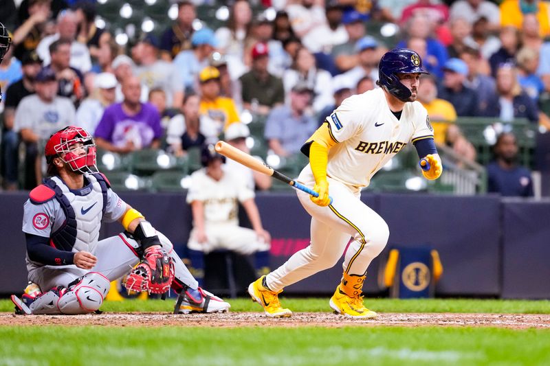 Sep 4, 2024; Milwaukee, Wisconsin, USA;  Milwaukee Brewers right fielder Garrett Mitchell (5) hits a triple during the seventh inning against the St. Louis Cardinals at American Family Field. Mandatory Credit: Jeff Hanisch-Imagn Images