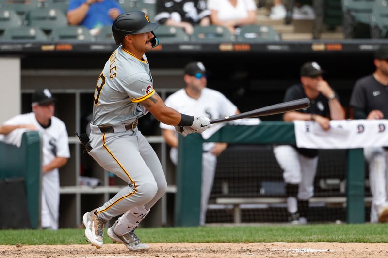 Jul 14, 2024; Chicago, Illinois, USA; Pittsburgh Pirates second baseman Nick Gonzales (39) hits a two-run triple against the Chicago White Sox during the seventh inning at Guaranteed Rate Field. Mandatory Credit: Kamil Krzaczynski-USA TODAY Sports