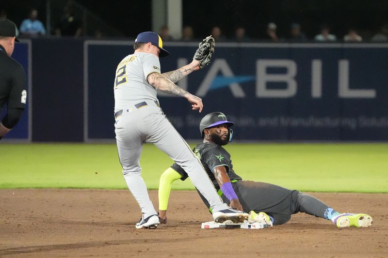 May 9, 2025; Tampa, Florida, USA; Tampa Bay Rays third base Junior Caminero (13) gets back to second safely after a pick off attempt by Milwaukee Brewers second base Brice Turang (2) during the eighth inning at George M. Steinbrenner Field. Mandatory Credit: Dave Nelson-Imagn Images