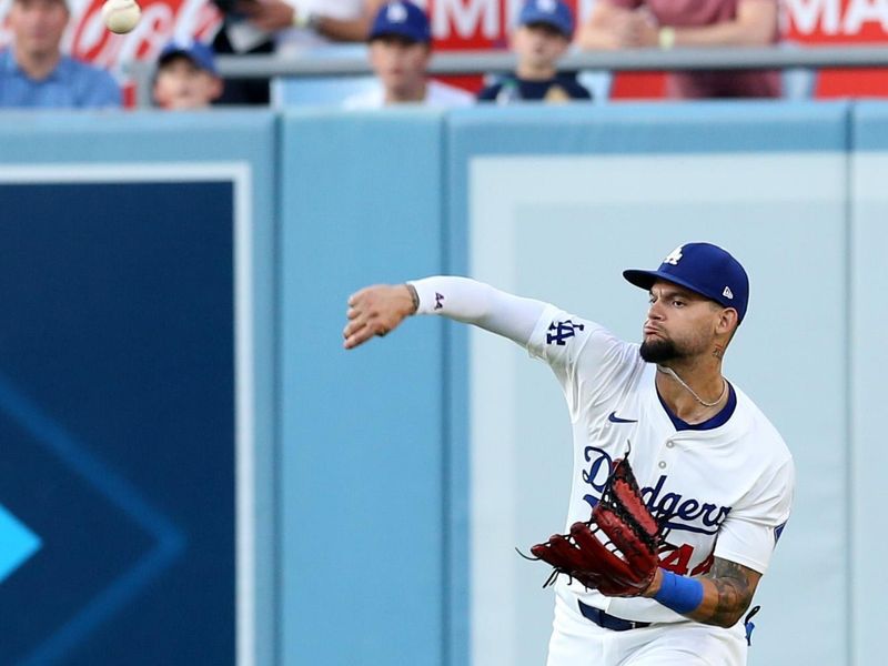 Jul 23, 2024; Los Angeles, California, USA; Los Angeles Dodgers outfielder Andy Pages (44) throws back to the infield during the first inning against the San Francisco Giants at Dodger Stadium. Mandatory Credit: Jason Parkhurst-USA TODAY Sports