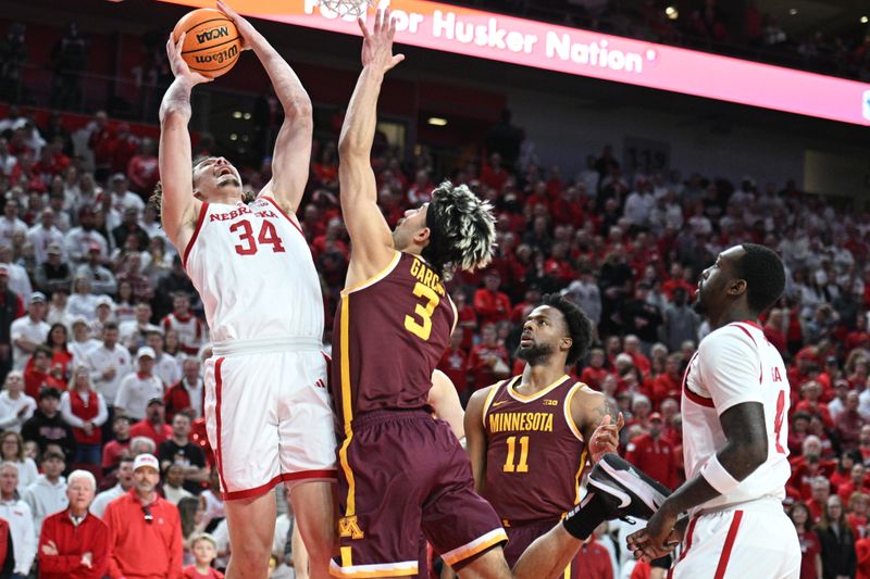 Mar 1, 2025; Lincoln, Nebraska, USA;  Nebraska Cornhuskers center Braxton Meah (34) attempts a shot against Minnesota Golden Gophers forward Dawson Garcia (3) during the first half at Pinnacle Bank Arena. Mandatory Credit: Steven Branscombe-Imagn Images