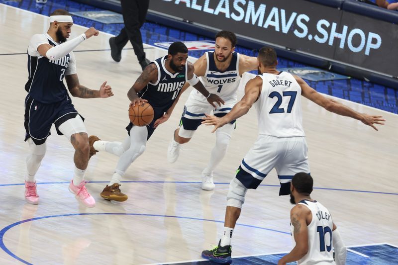 DALLAS, TX - MAY 28: Kyrie Irving #11 of the Dallas Mavericks handles the ball during the game against the Minnesota Timberwolves during Round 3 Game 4 of the 2024 NBA Playoffs on May 28, 2024 at the American Airlines Center in Dallas, Texas. NOTE TO USER: User expressly acknowledges and agrees that, by downloading and or using this photograph, User is consenting to the terms and conditions of the Getty Images License Agreement. Mandatory Copyright Notice: Copyright 2024 NBAE (Photo by David Sherman /NBAE via Getty Images)