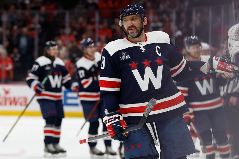 Feb 20, 2024; Washington, District of Columbia, USA; Washington Capitals left wing Alex Ovechkin (8) celebrates with teammates after scoring a goal against the New Jersey Devils in the third period at Capital One Arena. Mandatory Credit: Geoff Burke-USA TODAY Sports