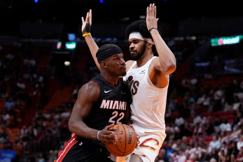 MIAMI, FLORIDA - MARCH 24: Jimmy Butler #22 of the Miami Heat drives against Jarrett Allen #31 of the Cleveland Cavaliers during the third quarter at Kaseya Center on March 24, 2024 in Miami, Florida. NOTE TO USER: User expressly acknowledges and agrees that, by downloading and or using this photograph, User is consenting to the terms and conditions of the Getty Images License Agreement. (Photo by Rich Storry/Getty Images)