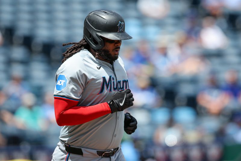 Jun 26, 2024; Kansas City, Missouri, USA; Miami Marlins first baseman Josh Bell (9) runs to first base after drawing a walk against the Kansas City Royals during the first inning at Kauffman Stadium. Mandatory Credit: William Purnell-USA TODAY Sports