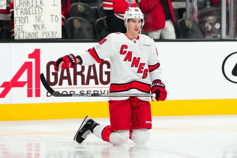 Nov 11, 2024; Las Vegas, Nevada, USA; Carolina Hurricanes center Martin Necas (88) warms up before a game against the Vegas Golden Knights at T-Mobile Arena. Mandatory Credit: Stephen R. Sylvanie-Imagn Images