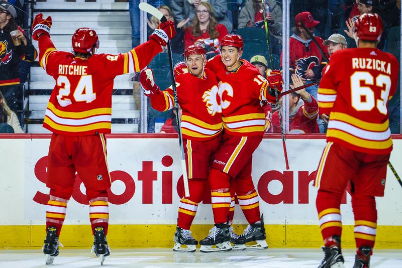 Nov 1, 2022; Calgary, Alberta, CAN; Calgary Flames center Trevor Lewis (22) celebrates his goal with teammates against the Seattle Kraken during the third period at Scotiabank Saddledome. Mandatory Credit: Sergei Belski-USA TODAY Sports