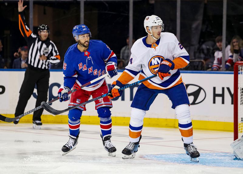 Sep 24, 2024; New York, New York, USA; New York Rangers center Vincent Trocheck (16) and New York Islanders defenseman Scott Mayfield (24) battle in front of the net during the first period at Madison Square Garden. Mandatory Credit: Danny Wild-Imagn Images