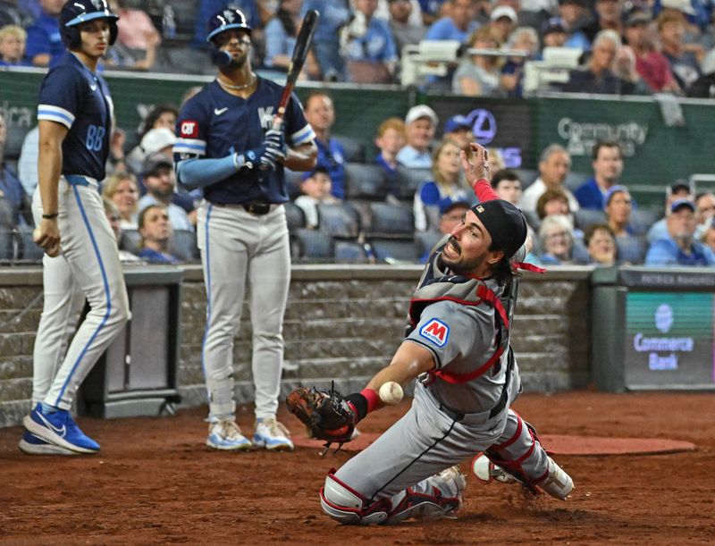 Jun 28, 2024; Kansas City, Missouri, USA;  Cleveland Guardians catcher Austin Hedges (27) makes a diving attempt for a foul ball in the sixth inning against the Kansas City Royals at Kauffman Stadium. Mandatory Credit: Peter Aiken-USA TODAY Sports