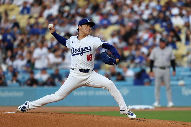 Jun 1, 2024; Los Angeles, California, USA;  Los Angeles Dodgers starting pitcher Yoshinobu Yamamoto (18) pitches during the first inning against the Colorado Rockies at Dodger Stadium. Mandatory Credit: Kiyoshi Mio-USA TODAY Sports