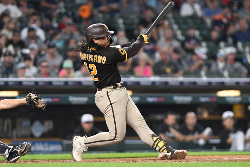 Jul 22, 2023; Detroit, Michigan, USA; San Diego Padres catcher Luis Campusano (12) hits a three-run home run against the Detroit Tigers in the eighth inning at Comerica Park. Mandatory Credit: Lon Horwedel-USA TODAY Sports