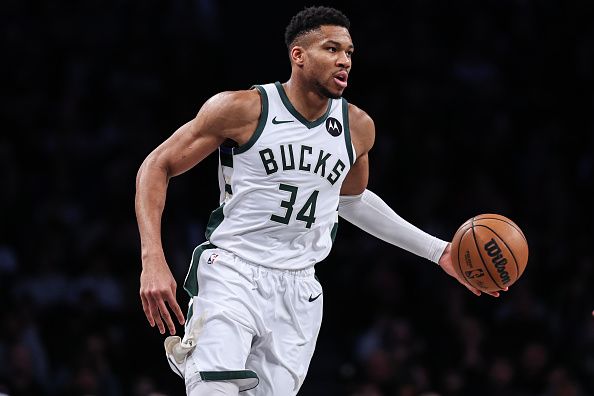 NEW YORK, NEW YORK - DECEMBER 27: Giannis Antetokounmpo #34 of the Milwaukee Bucks brings the ball up the court during the first quarter of the game against the Brooklyn Nets at Barclays Center on December 27, 2023 in New York City. NOTE TO USER: User expressly acknowledges and agrees that, by downloading and or using this photograph, User is consenting to the terms and conditions of the Getty Images License Agreement. (Photo by Dustin Satloff/Getty Images)