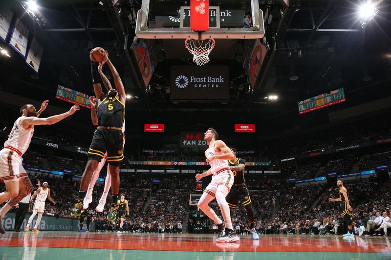 SAN ANTONIO, TX - MARCH 31: Kevon Looney #5 of the Golden State Warriors grabs the rebound during the game against the San Antonio Spurs on March 31, 2024 at the Frost Bank Center in San Antonio, Texas. NOTE TO USER: User expressly acknowledges and agrees that, by downloading and or using this photograph, user is consenting to the terms and conditions of the Getty Images License Agreement. Mandatory Copyright Notice: Copyright 2024 NBAE (Photos by Joe Murphy/NBAE via Getty Images)