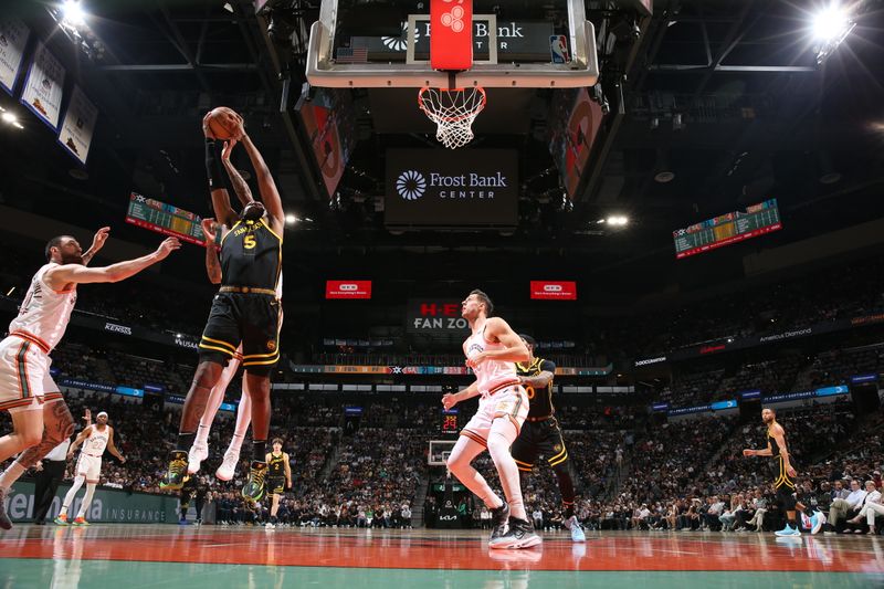 SAN ANTONIO, TX - MARCH 31: Kevon Looney #5 of the Golden State Warriors grabs the rebound during the game against the San Antonio Spurs on March 31, 2024 at the Frost Bank Center in San Antonio, Texas. NOTE TO USER: User expressly acknowledges and agrees that, by downloading and or using this photograph, user is consenting to the terms and conditions of the Getty Images License Agreement. Mandatory Copyright Notice: Copyright 2024 NBAE (Photos by Joe Murphy/NBAE via Getty Images)