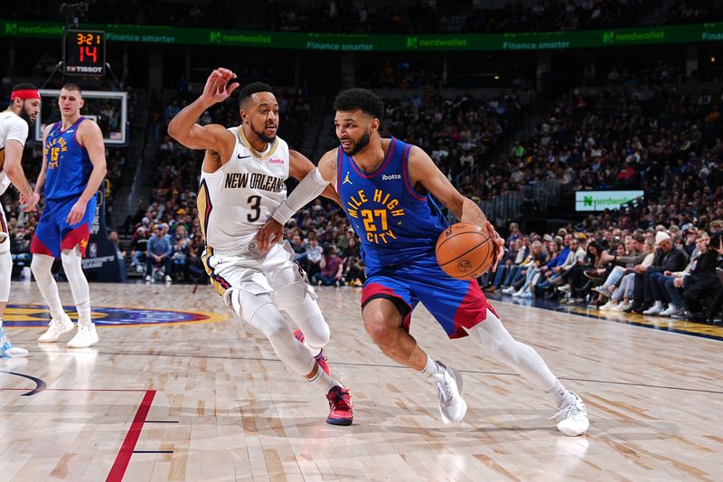 DENVER, CO - JANUARY 12: Jamal Murray #27 of the Denver Nuggets drives to the basket during the game against the New Orleans Pelicans  on January 12, 2024 at the Ball Arena in Denver, Colorado. NOTE TO USER: User expressly acknowledges and agrees that, by downloading and/or using this Photograph, user is consenting to the terms and conditions of the Getty Images License Agreement. Mandatory Copyright Notice: Copyright 2024 NBAE (Photo by Garrett Ellwood/NBAE via Getty Images)