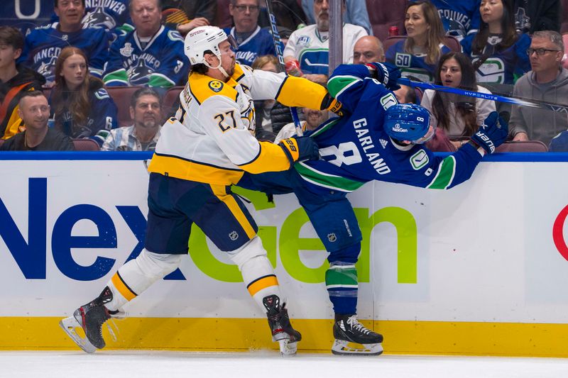 Apr 21, 2024; Vancouver, British Columbia, CAN; Nashville Predators defenseman Ryan McDonagh (27) checks Vancouver Canucks forward Conor Garland (8) in the second period in game one of the first round of the 2024 Stanley Cup Playoffs at Rogers Arena. Mandatory Credit: Bob Frid-USA TODAY Sports