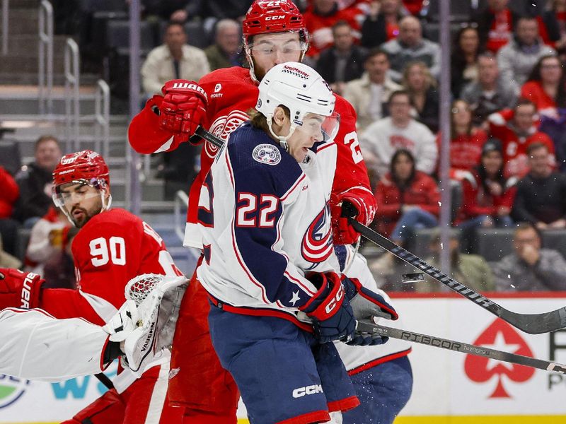 Mar 19, 2024; Detroit, Michigan, USA; Columbus Blue Jackets defenseman Jake Bean (22) blocks a shot with his body during the third period of the game against the Detroit Red Wings at Little Caesars Arena. Mandatory Credit: Brian Bradshaw Sevald-USA TODAY Sports