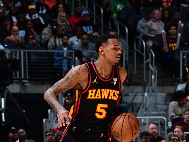 ATLANTA, GA - February 23: Dejounte Murray #5 of the Atlanta Hawks handles the ball during the game against the Toronto Raptors on February 23, 2024 at State Farm Arena in Atlanta, Georgia.  NOTE TO USER: User expressly acknowledges and agrees that, by downloading and/or using this Photograph, user is consenting to the terms and conditions of the Getty Images License Agreement. Mandatory Copyright Notice: Copyright 2024 NBAE (Photo by Scott Cunningham/NBAE via Getty Images)