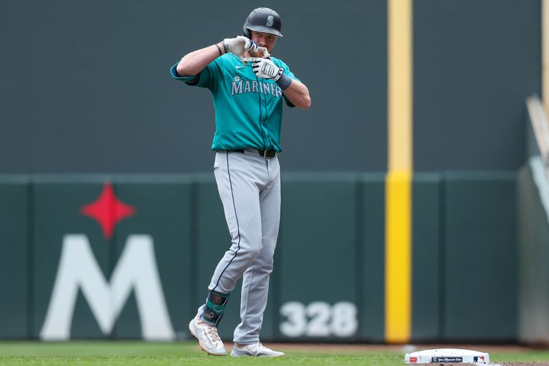 May 9, 2024; Minneapolis, Minnesota, USA; Seattle Mariners Luke Raley (20) celebrates his RBI single against the Minnesota Twins during the second inning at Target Field. Mandatory Credit: Matt Krohn-USA TODAY Sports