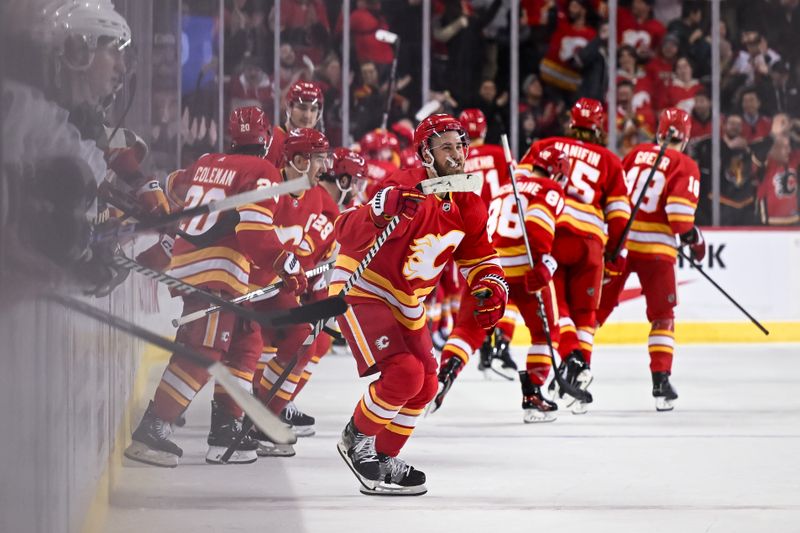 Jan 16, 2024; Calgary, Alberta, CAN; Calgary Flames defenseman Jordan Oesterle (82) and teammates take to the ice after beating the Arizona Coyotes 3-2 in overtime at Scotiabank Saddledome. Mandatory Credit: Brett Holmes-USA TODAY Sports