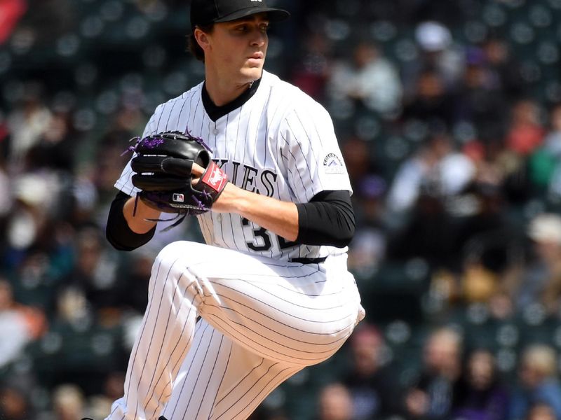Apr 19, 2025; Denver, Colorado, USA; Colorado Rockies pitcher Chase Dollander (32) throws during the first inning against the Washington Nationals at Coors Field. Mandatory Credit: Christopher Hanewinckel-Imagn Images
