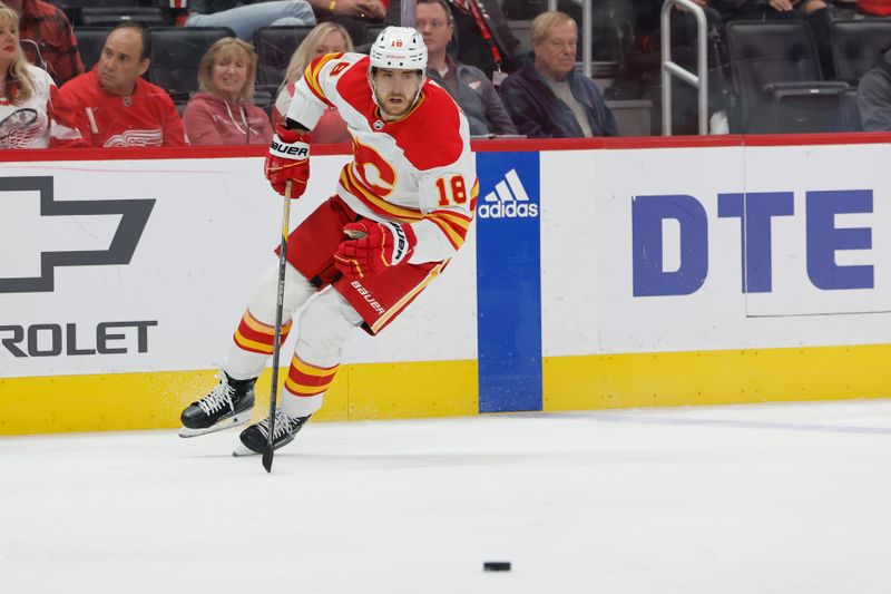 Oct 22, 2023; Detroit, Michigan, USA;  Calgary Flames left wing A.J. Greer (18) skates with the puck in the first period against the Detroit Red Wings at Little Caesars Arena. Mandatory Credit: Rick Osentoski-USA TODAY Sports