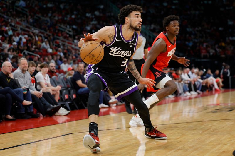 HOUSTON, TEXAS - NOVEMBER 06: Chris Duarte #3 of the Sacramento Kings controls the ball against the Houston Rockets during the first half at Toyota Center on November 06, 2023 in Houston, Texas. (Photo by Carmen Mandato/Getty Images)