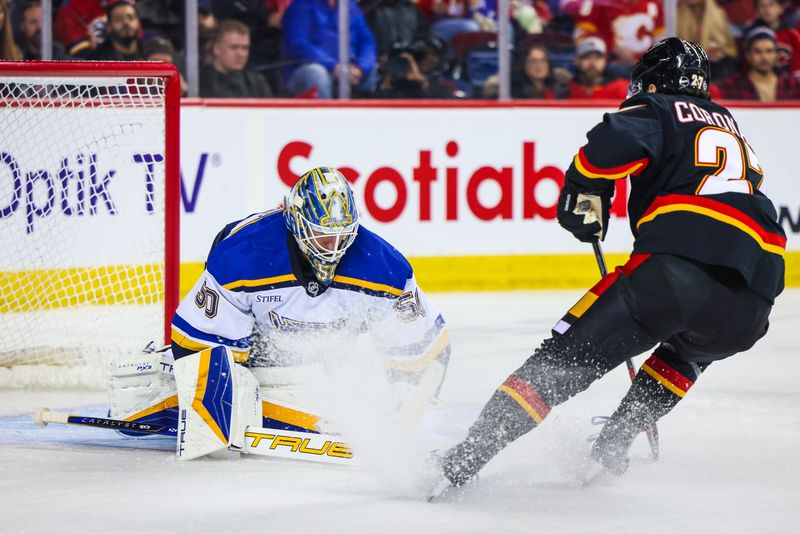 Jan 23, 2024; Calgary, Alberta, CAN; St. Louis Blues goaltender Jordan Binnington (50) makes a save against the Calgary Flames during the second period at Scotiabank Saddledome. Mandatory Credit: Sergei Belski-USA TODAY Sports