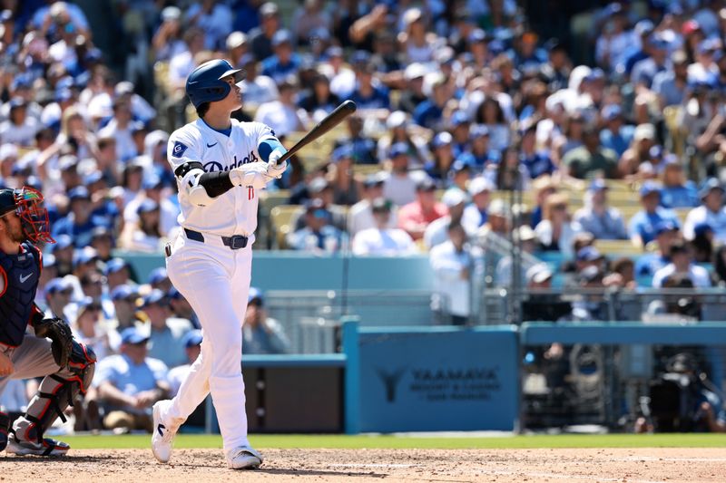 May 5, 2024; Los Angeles, California, USA;  Los Angeles Dodgers designated hitter Shohei Ohtani (17) hits a home run during the eighth inning against the Atlanta Braves at Dodger Stadium. Mandatory Credit: Kiyoshi Mio-USA TODAY Sports
