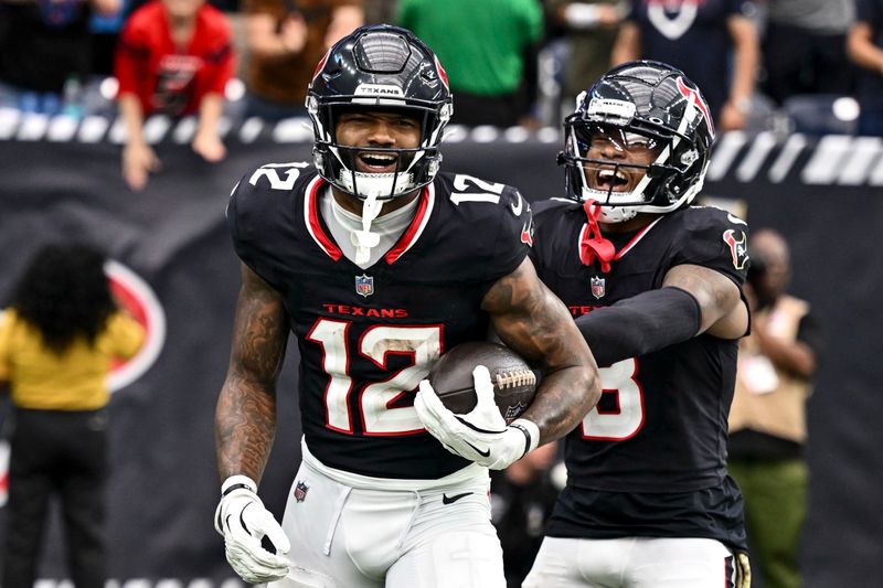 Houston Texans wide receiver Nico Collins (12) and wide receiver John Metchie III (8) react in the second half against the Tennessee Titans NFL football game, Sunday, Nov 24, 2024 in Houston. The Titans defeated the Texans 32-27. (AP Photo/Maria Lysaker)