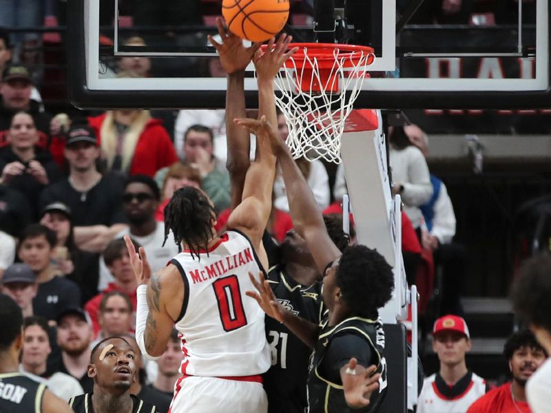 Feb 10, 2024; Lubbock, Texas, USA;  Texas Tech Red Raiders guard Chance McMillian (0) shoots over Central Florida Knights forward Thierno Sylla (31) in the first half United Supermarkets Arena. Mandatory Credit: Michael C. Johnson-USA TODAY Sports