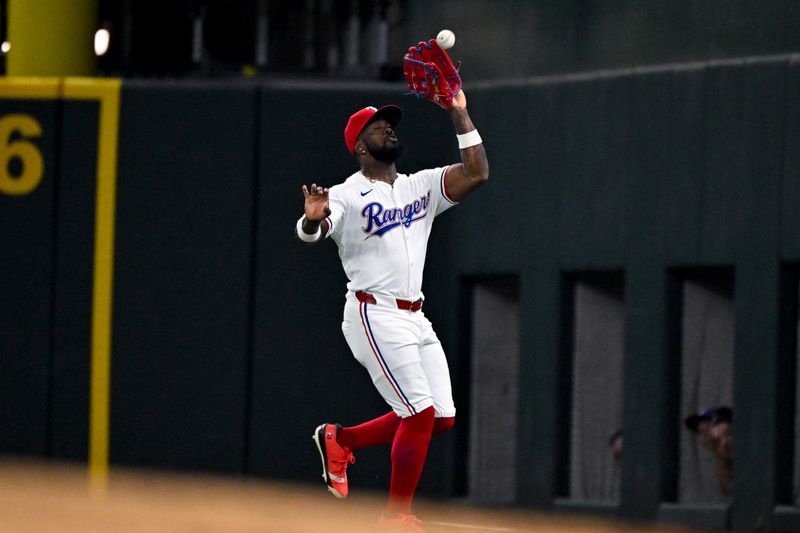 Aug 5, 2024; Arlington, Texas, USA; Texas Rangers right fielder Adolis Garcia (53) catches a fly ball hit by Houston Astros left fielder Chas McCormick (not pictured) during the fifth inning at Globe Life Field. Mandatory Credit: Jerome Miron-USA TODAY Sports