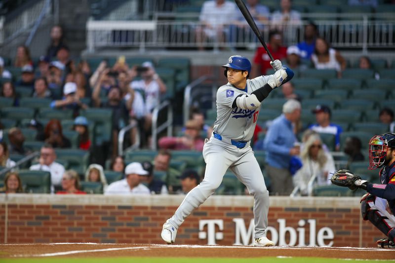 Sep 13, 2024; Atlanta, Georgia, USA; Los Angeles Dodgers designated hitter Shohei Ohtani (17) bats against the Atlanta Braves in the first inning at Truist Park. Mandatory Credit: Brett Davis-Imagn Images