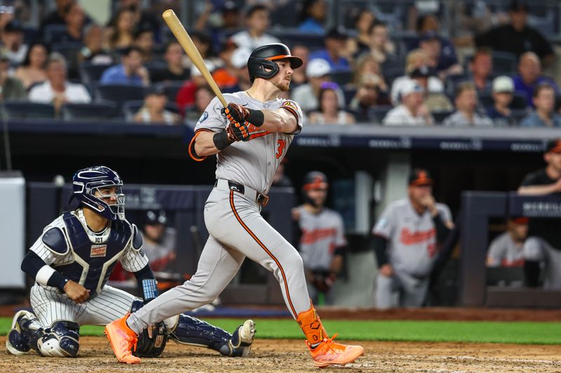 Jun 19, 2024; Bronx, New York, USA;  Baltimore Orioles designated hitter Ryan O'Hearn (32) hits a RBI double in the fifth inning against the New York Yankees at Yankee Stadium. Mandatory Credit: Wendell Cruz-USA TODAY Sports